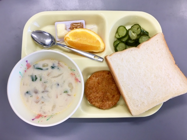 Cream of vegetable soup, pickled cucumbers, potato croquette, orange slice and a HUGE slice of thick Japanese bread with butter and maple syrup.